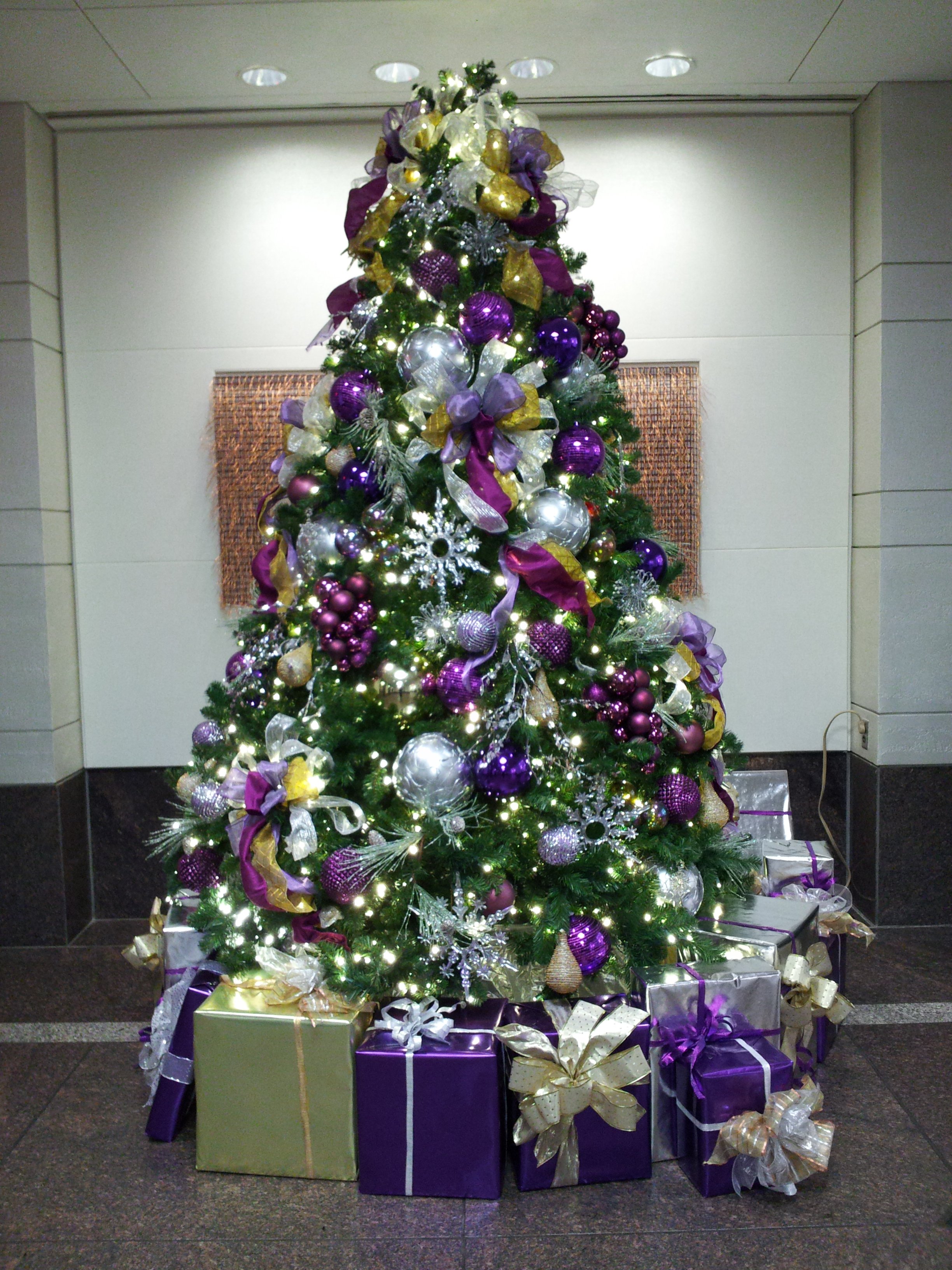 purple ornaments purple ribbons purple trim and purple presents under ...