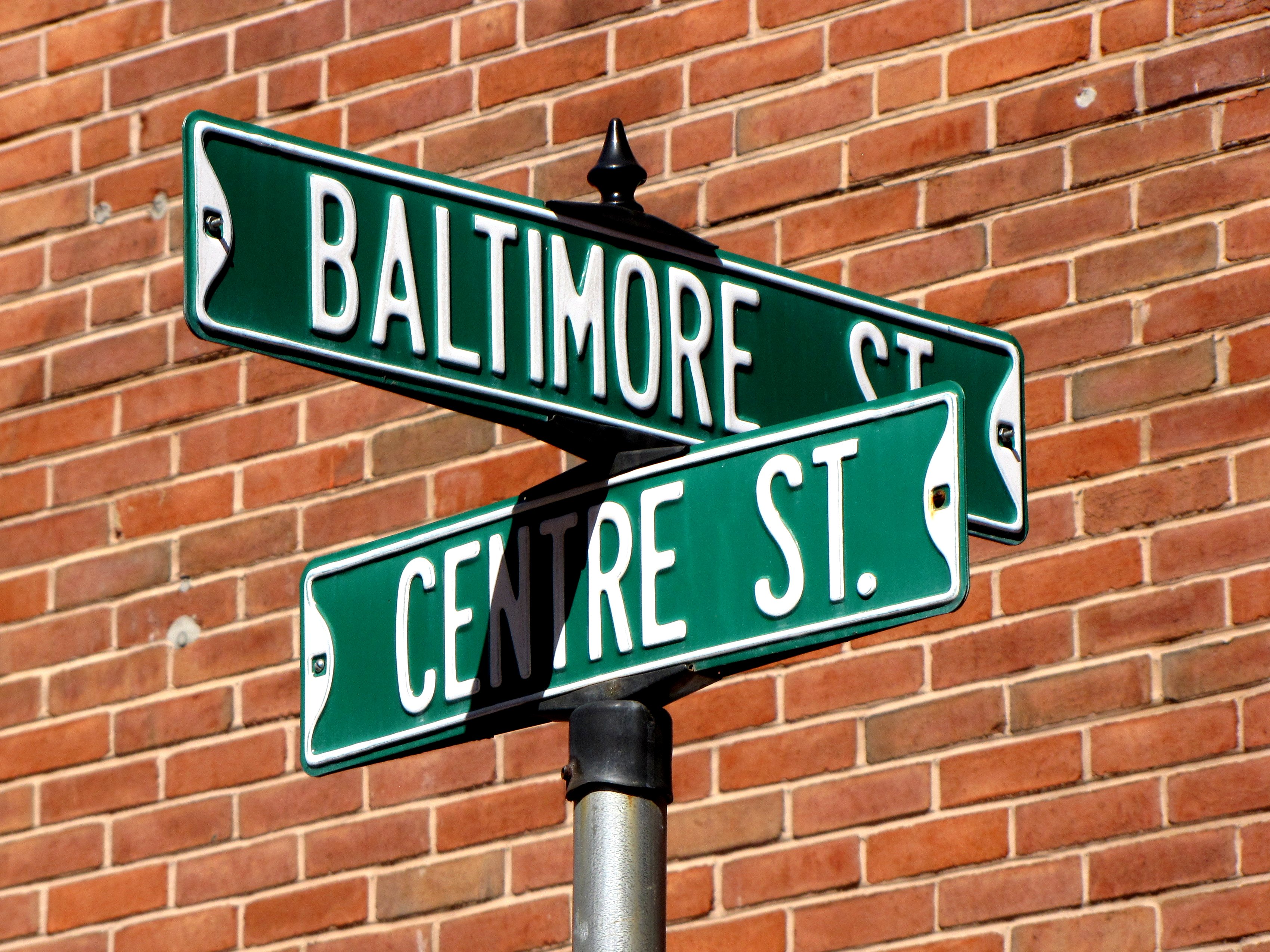 Street signs at the intersection of Baltimore and Centre Streets in downtow...