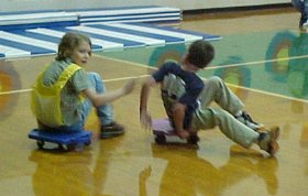 Children playing Pac-Man Scooters