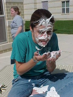 A person just after having received a pie in the face