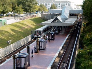 This is a spot that Oren occasionally uses. It's neat. It's along a road that goes over the tunnels north of the Grosvenor-Strathmore station, affording an excellent aerial view of the station. I like aerial views of the outdoor stations, since it's not your normal view of Metro stations (the normal view being from within the station). 