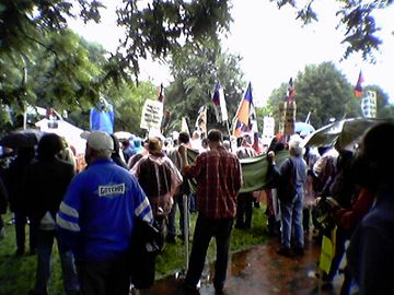 The protest group at Lafayette Park, in the rain, listening to speakers before the march.