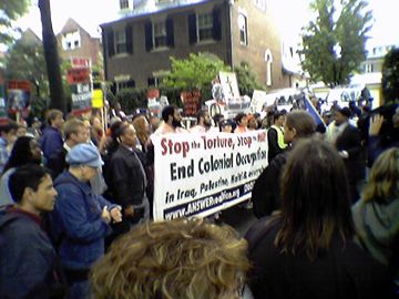Approaching Donald Rumsfeld's house. Police initially did not let the entire crowd through for purposes of crowd control, as Kalorama Road is not a particularly large street. The police eventually relented, and opened the gates. Meanwhile, we all began yelling, "WHOSE STREETS? OUR STREETS!"