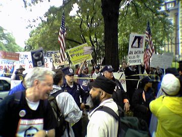 There was also a confrontation with a small group of counter-protesters that we met on Kalorama Road. These counter-protesters were in support of Bush, Rumsfeld, and the war, and were on the opposite side of the police lines from us.