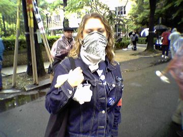 We also encountered a number of masked protesters in the crowd, who went masked for various reasons. The girl in the pink bandanna actually commented to me, "This is why I cover my face at these events," after I took her picture (with permission) during the march.