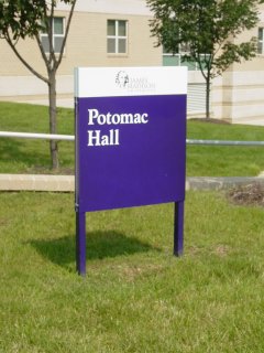 Purple sign in front of Potomac Hall. This was put in the summer before my third year in Potomac. Before that, we had a black sign.