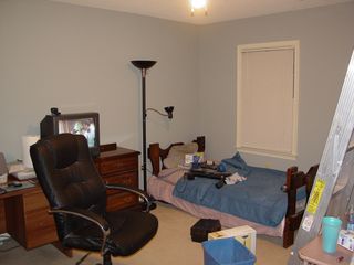 Notice the desk and dresser are in similar positions as before, but about two feet to the left, and I have a Mainstays torchiere lamp with reading light next to the bed.
