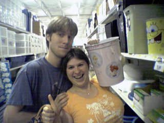 They not only bought this cute tiger-striped adaptor, but also a whole bunch of other things, and also posed with a whole bunch of other stuff, like a Disney Princess trash can.