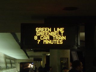 PIDS screen showing an eight-car Green Line train to Greenbelt.