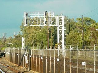 These are newer signals, which I first heard described as "Darth Vaders", since their shape somewhat resembles the helmet of Darth Vader from Star Wars.