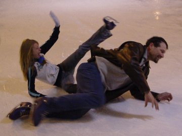 Two people take a spill on the ice at Pentagon Row