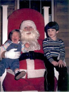 Sis and I sitting on Santa's lap in 1985