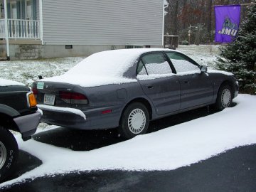 This is Sis's car, idle while she's at VT, also covered with snow.