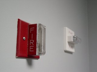 Two different fire alarm strobes, side by side