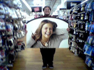 Holding a large picture of a woman