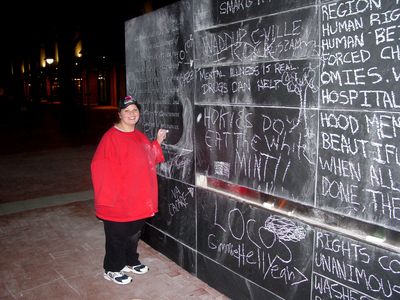 And of course, I got a photo of Katie doodling on the wall. It was quite cold on this particular evening, and so Katie's got her other arm tucked way back into her sleeve.