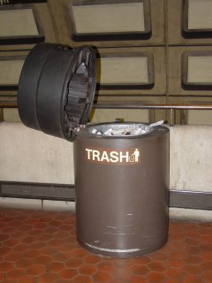 This would be a bomb-containment trash can, unattended with its lid up. I found it pertinent because it was brought up in the May 4 LunchTalk Chat with John Catoe, where he said he would pass the information on. Of course, the lid is there to further contain a potential explosion. The lid left up somewhat compromises this…