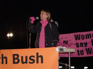 Medea Benjamin took the mic for a bit before Bush began speaking.