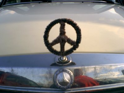 Mercedes logo turned into a peace sign