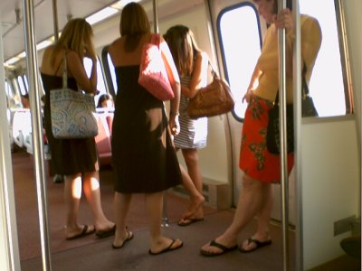 Notice anything wrong here? The princess lost her shoe! I see eight feet and seven shoes. Looks like the girl in the stripes didn't "mind the gap" when this party boarded Breda 3072 at Crystal City.