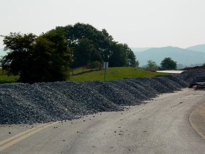 Gravel piles next to park and ride on old Shenandoah Village Drive alignment