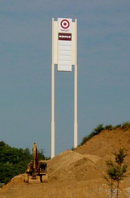 The tall sign from the Outlet Village, repurposed for the new shopping center.