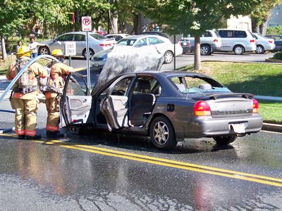 Continuing to hose down under the hood, where it looked like the fire started.