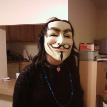 Isis' daughter tries on the Guy Fawkes mask