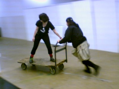 Jeff pushes Maddy around on the cart