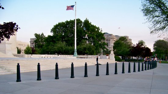 Personally, I think that this could have been done a lot more tastefully, because right now as it stands, it ruins the view and obstructs pedestrian flow to an extent, because it is admittedly in the middle of the sidewalk. Presumably, the bollards are there to keep crazy people from driving their cars into the Supreme Court, but this could have been done differently and have been just as effective without compromising aesthetics and pedestrian flow. My recommendation would have been to install bollards at the curb. This would still prevent cars from reaching the Supreme Court, but would not affect pedestrian flow, and would be easier to overlook, thus not ruining the aesthetics.