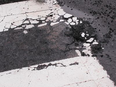 The water was coming up out of the street at roughly the location of that bump in the pavement.