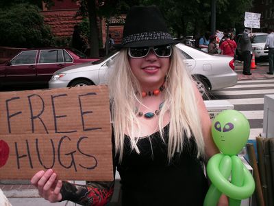 Posing with a "Free Hugs" sign and our little friend...