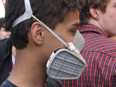 A teen wears a respirator at Funk the War 8.