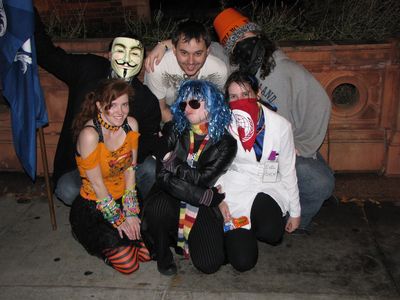Some of the Boston and NYC Anons pose for a photo in front of the Founding Org.