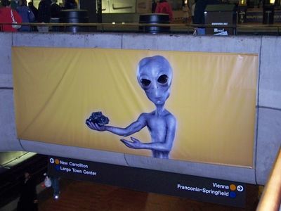 All the ads in Metro Center were bought up by This Is Reality, and this was one of their advertisements. I realize that this is an ad taking on the myth of clean coal, thus showing an alien holding a lump of coal. But doesn't it look like the alien Xenu is holding L. Ron Hubbard's brain?