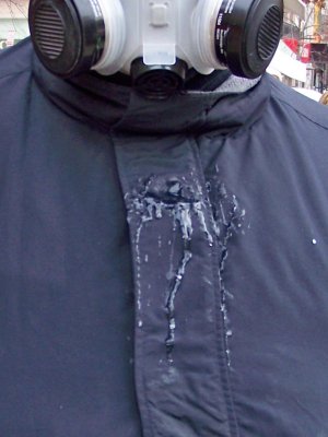 Condensation from my breath that formed inside the mask, and then dripped out the front vent and froze on my coat.