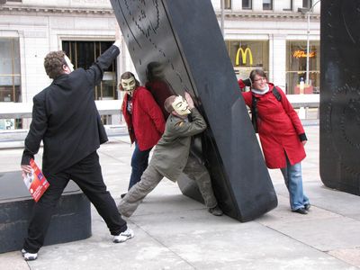 In this photo, we are pretending to hold up the giant domino, while we got the female tourist (visiting Philadelphia from Germany) to pose on the other side to represent the Church of Scientology trying to push the domino down on us.