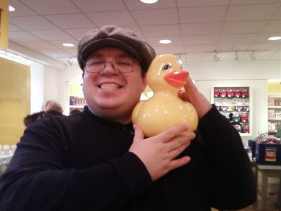 Holding up the rubber duck at Bath and Body Works