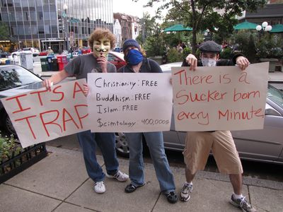 Three of our new Anons pose with their signs.