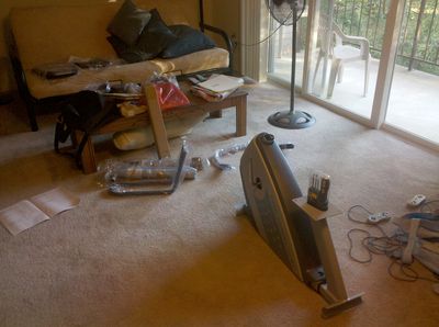 The exercise bike spread out around my living room, awaiting assembly