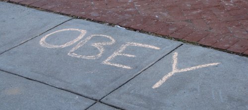 "OBEY" in chalk