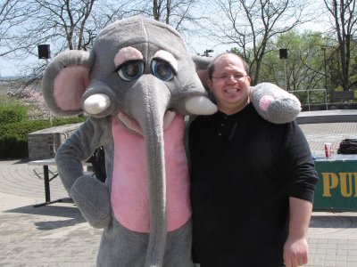 I pose with the elephant man