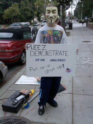 This was a new sign, basically saying that the Scientologists need to either demonstrate OT powers or get out already.