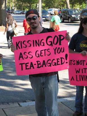 "Kissing GOP ass gets you TEA-BAGGED!" Best. Sign. Ever. After all, the GOP is not really concerned with the Tea Party's best interests. The Tea Party will be the first ones in line to get screwed by Republican initiatives.