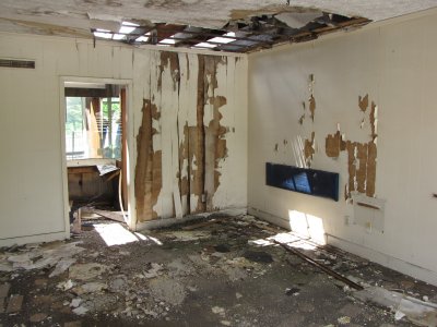 Abandoned hotel room, part of this row of abandoned hotel rooms. Unlike when I photographed in 2003, these rooms are now wide open, and the roof has deteriorated considerably.