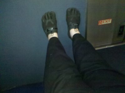 There is, however, a certain benefit to being up in the bulkhead seat. Feet up! Ah, yeah...