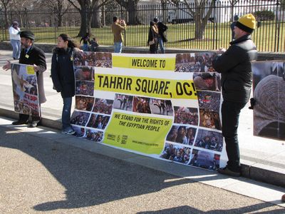 As I was getting ready to leave to go to the embassy demonstration, a group with a large banner from Amnesty International USA showed up.