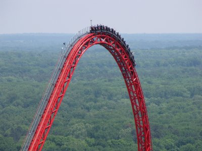 The roller coaster car goes over the top of the Intimidator 305 ride.
