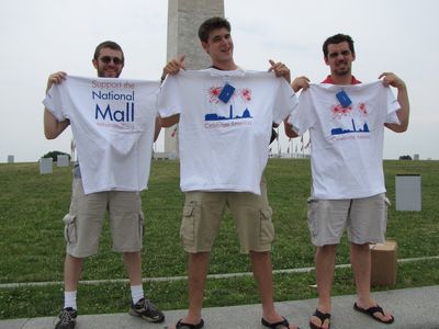 Jon, Jory, and Riley hold up their new shirts