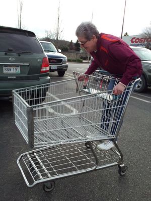 And then speaking of Mom, yes, she is doing exactly what you're thinking she's doing. She is riding the cart down the parking lot at Costco. Mom is small enough that she can ride the cart down the lot unloaded. I can't do that. Fully loaded, maybe, but I'm too mature to engage in such antics. Mom, meanwhile, even went so far as to say that you can be immature forever. And there you go, I suppose. Still riding the cart down the lot at sixty years old.